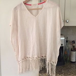 Cream knit poncho style top.